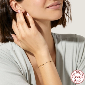 Elegant S925 sterling silver gold bracelet with black beads and a white pearl pendant