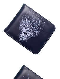 Close-up of black PU leather wallet featuring white skull pattern and detailed stitching