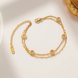Elegant rose gold double-layer chain bracelet with Roman numeral charms and clear crystals