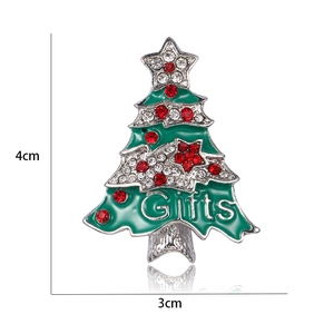 Detail of Christmas tree brooch with green enamel, rhinestones and Gifts engraving, 4x3cm
