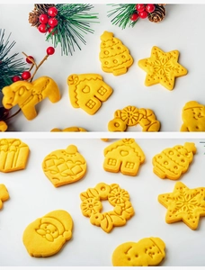 Close-up of golden Christmas cookies in shapes of trees, snowflakes and gingerbread men