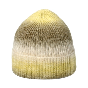 Macro detail of gradient yellow and brown knitted beanie showing vertical rib textures