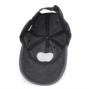 Detail of gray washed cotton baseball cap interior with heart embroidery and metal buckle