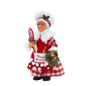 Christmas chef doll ornament with red plaid apron, wooden spoon and Merry Christmas text