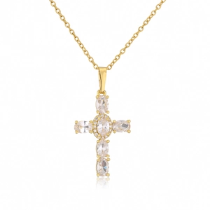 Close-up of golden cross necklace featuring oval white cubic zirconia in prong setting