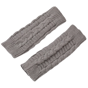 Light gray cable knit fingerless gloves for winter with elastic ribbed cuffs on white background