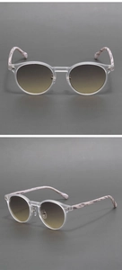 Detail of round frosted sunglasses with brown gradient lenses and marble pattern temples