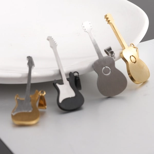Detailed view of guitar-shaped pendants in gold, silver, and black stainless steel
