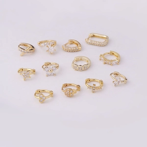 8MM golden huggie hoop earrings with zircon hearts, stars and crosses on white background