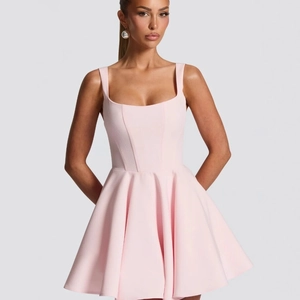 Pink A-line princess dress with square neck and pleated skirt in professional studio shot