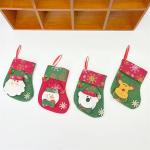 Set of four festive Christmas stockings featuring Santa, Snowman, Polar Bear, and Reindeer