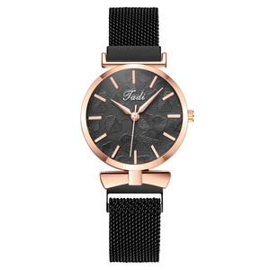 Women's quartz watch with black leaf embossed dial and magnetic Milanese strap
