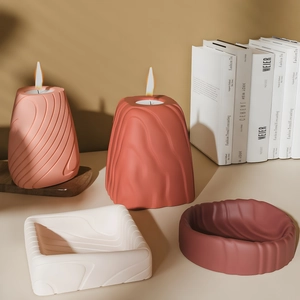 Minimalist mountain candle set with striped tray and round ripple containers in soft colors