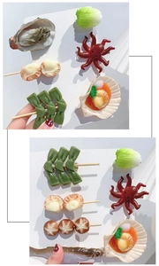 Detail of creative resin hair clips in various realistic food shapes like seafood and snacks