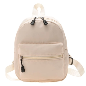 Classic beige nylon mini backpack for women featuring an adjustable strap on white background