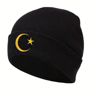 Knit beanie with yellow moon and star embroidery on black ribbed cuff winter hat