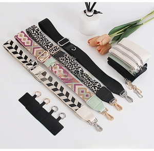 Detail showing four stylish replacement bag straps with mini wallets on white background