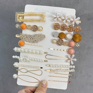 Detailed set of 20 assorted fashion hair clips featuring pearls and rhinestones on card