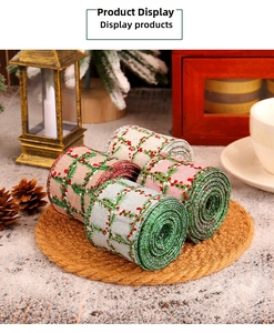 Close-up of four plaid Christmas ribbons with holly patterns on a decorative mat