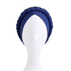 Detail view of the deep blue braided turban hat with soft elastic knit texture