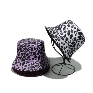 Stylish leopard print bucket hats in purple and white, ideal for summer sun protection