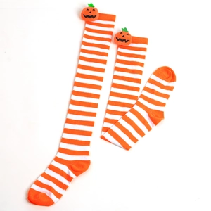 Detail of orange and white striped over-knee socks with 3D pumpkin accents for Halloween