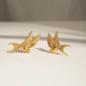 Minimalist gold stainless steel swallow bird stud earrings for women with feather detail