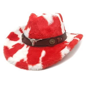 Detail of red and white cow print cowboy hat with plush texture and bull head ornament