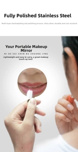 Macro view of portable stainless steel makeup mirror with polished metal finish
