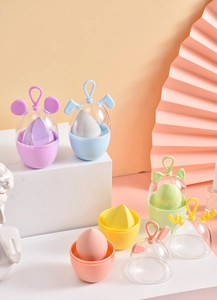 Detail of colorful beauty blender storage cases with cute animal ear shaped lids