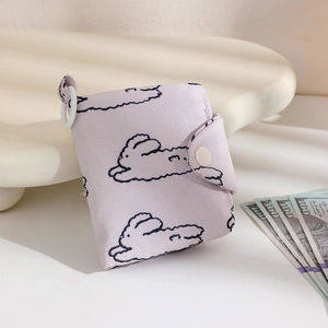 Close-up of lilac floral canvas coin purse with bunny print and snap button closure