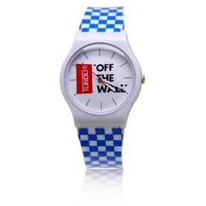 Detail view of the blue and white checkerboard strap and dial on a casual sports watch