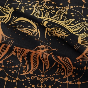 Detail of bohemian sun and moon tapestry showing soft fiber texture and gold printing