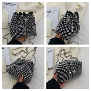 Detailed views of a black rhinestone bucket bag with pearl accents and metal chains