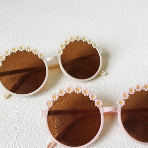 Kids round floral sunglasses in beige and pink with white daisy flower decorations