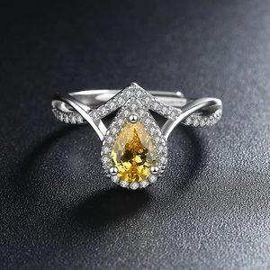 Minimalist silver open ring with teardrop yellow zircon and sparkling accent stones