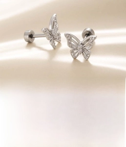 Detail of silver butterfly cartilage stud with cubic zirconia and flat screw back