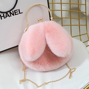 Pink plush bunny ear crossbody bag with gold round handle and chain strap for women