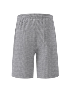 Detail of gray corduroy shorts featuring elastic waistband and ribbed texture back pocket