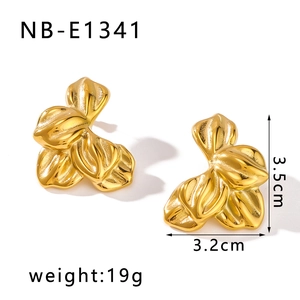 Detail view of gold floral earrings with texture, size 3.5cm and weight 19g