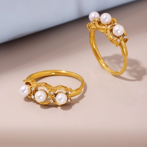 Adjustable gold stainless steel ring featuring three white pearls and zircon accents