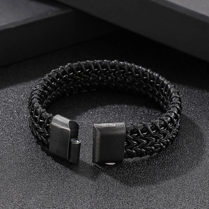 Macro shot of black braided leather bracelet with high-quality magnetic metal clasp
