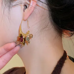 18k gold plated bohemian tassel drop earrings with colorful stones on model