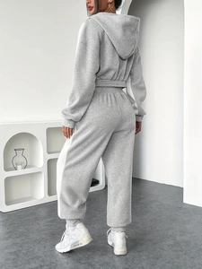 Back view of women's grey hooded sweatshirt and joggers two-piece lounge set
