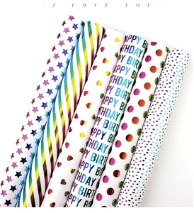 Detail of metallic gift wrapping paper set with colorful stars, stripes and hearts patterns