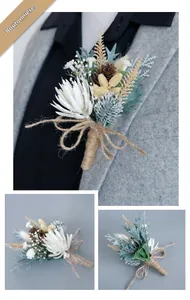 Detailed view of forest-style pine cone boutonniere with linen rope and safety pin back