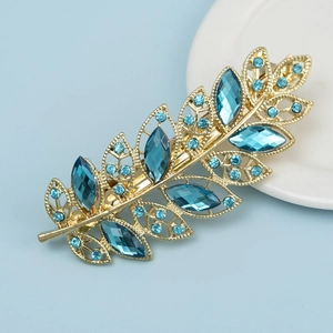 Pince à cheveux élégante en métal doré en forme de feuille avec gemmes et strass bleus
