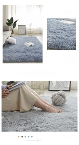 Detailed macro view of tie-dye plush rug texture in lake blue and silver gray tones