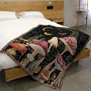 Detailed macro view of woven mushroom tapestry with intricate jacquard texture and fringe