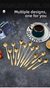 Detailed collection of golden stainless steel flower shaped dessert and coffee spoons
